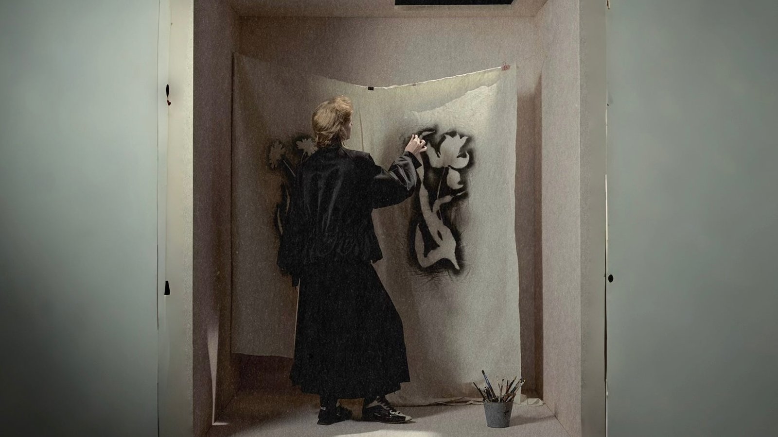 Woman wearing a structured black Shop Immore look in an art studio